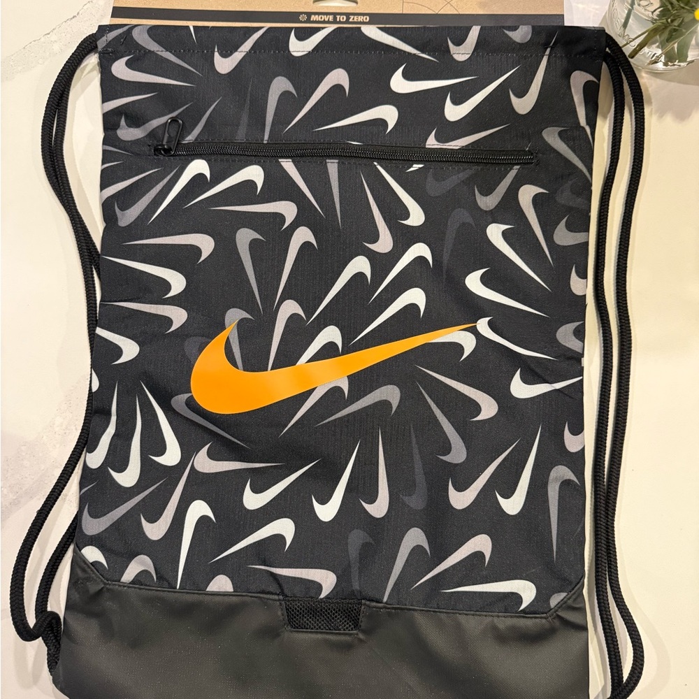 Nike Black Drawstring Bag with Orange Swoosh and Gray/White Print